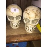 A pair of plastic skulls with mechanical movement.