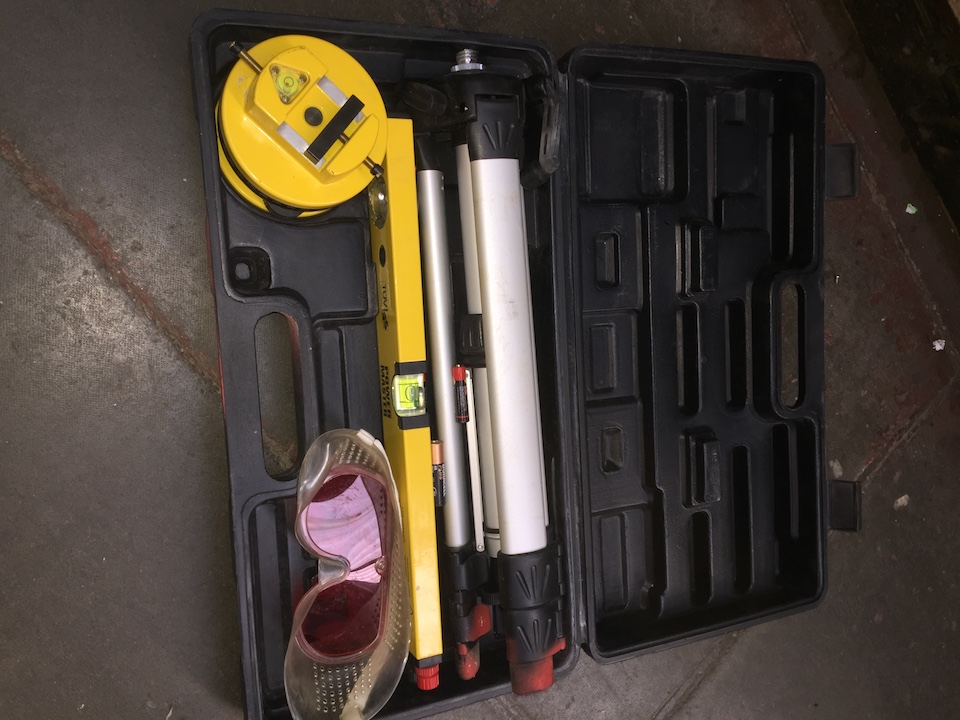 A Power Master laser tool kit in case.