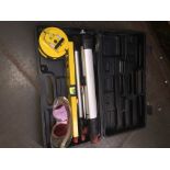 A Power Master laser tool kit in case.