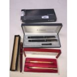 A mixed lot of pens comprising a Parker Slimfold with 14K nib, a Parker 88 fountain and ballpoint