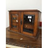 An oak smoker's cabinet.