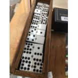 Wooden box of plastic dominoes