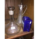 A decanter, claret jug and Seagram Grand national water jug