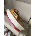 An RC wooden model boat - no remote.