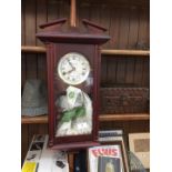 A vintage Lincoln 31 days movement, wooden wall hanging clock, key winding.