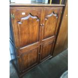 A large oak cabinet by Douglas Hosking.