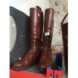 A pair of Tan leather riding boots