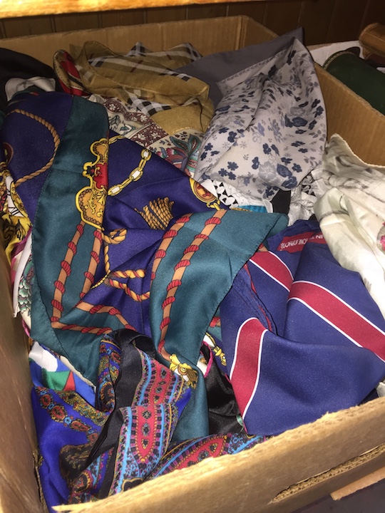 A collection of scarves to include signed ones, silk, etc.