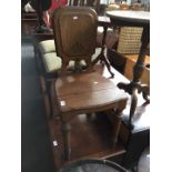 A 19th century oak hall chair by Doveston Davey Hull & Co Manchester.