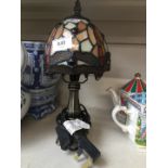 A small Tiffany style reproduction table lamp