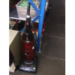 A Hoover Dust Manager Cyclonic upright vacuum cleaner.