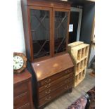 An Edwardian inlaid mahogany bureau bookcase.