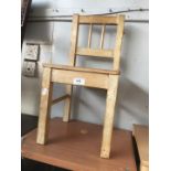 A child's light wood chair.