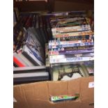 A box of DVDs and CDs