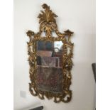 A gilt wood framed mirror 56cm x 110cm.