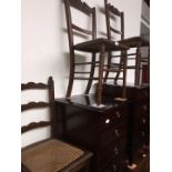 A pair of Edwardian chairs and an oak ladder back chairs.