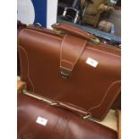 A Hideonline multi-compartmental travel grab bag / suitcase, in brown leather.