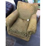 An Edwardian mustard damask armchair.