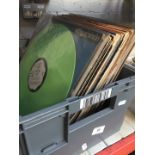 A box of 1970s - 1980s LPs and 12" singles.