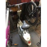 An electric scooter complete with charger and key, (working order)