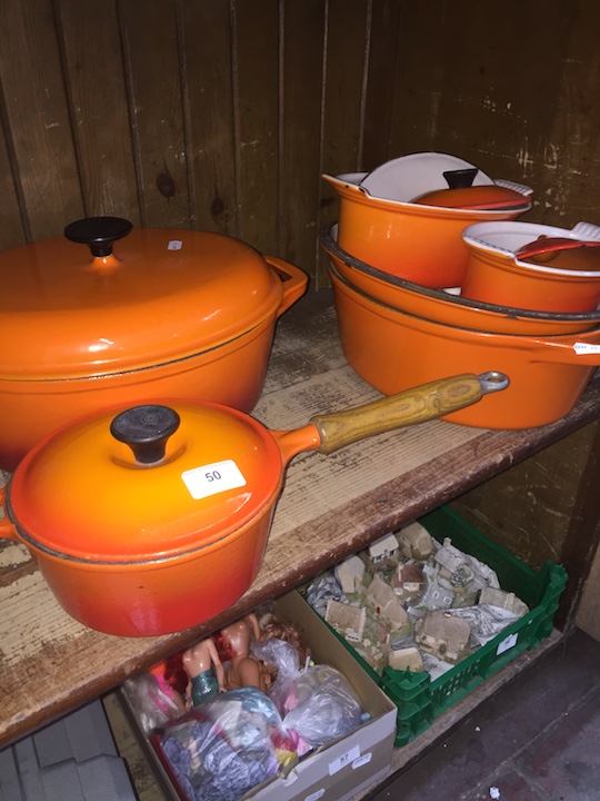 A large selection of "Le Creuset" style cookware