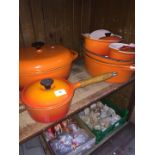 A large selection of "Le Creuset" style cookware