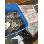 A box of world coins and banknotes