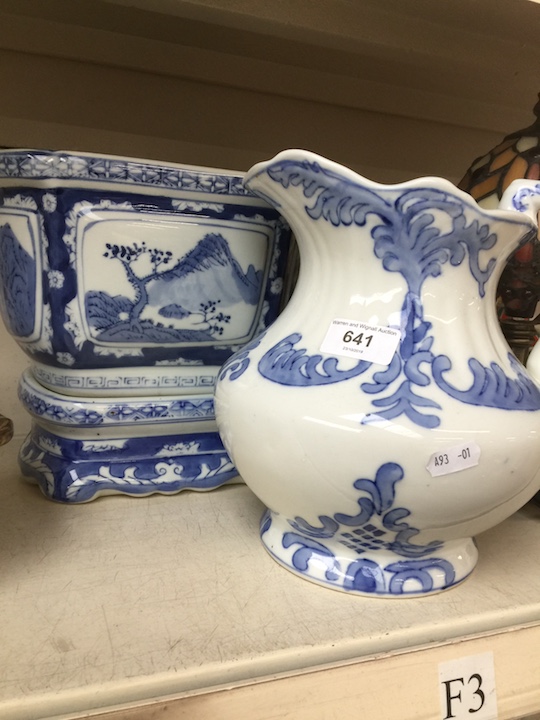 Blue and white planter on stand and jug