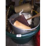 A large green tub with contents to include a bed warming bottle, aluminium cooking pan, decorative