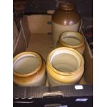 A box of stoneware jars