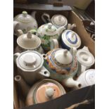 A box containing 10 teapots