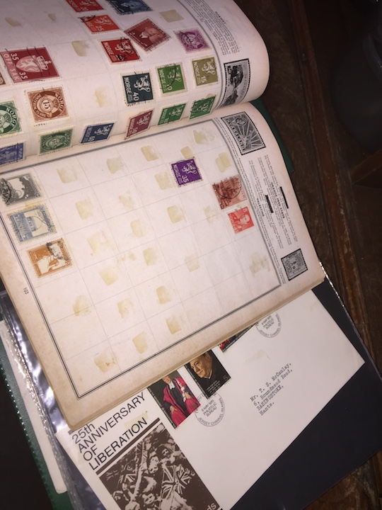 A collection of First Day covers and The Corona stamp album.