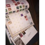 A collection of First Day covers and The Corona stamp album.