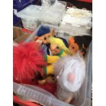 A box of Trolls soft toys