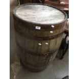 A metal bound oak barrel.