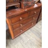 A Victorian mahogany chest of drawers having oak lined drawers, bun handles and feet.