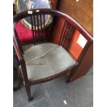 An Edwardian mahogany pierced back chair of curved form.