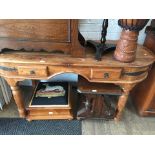 A rustic style hardwood side table with drawers