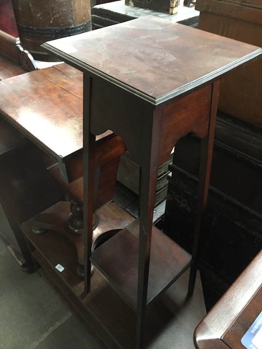 An Edwardian mahogany plant stand.