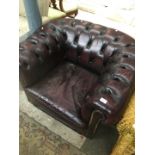A Chesterfield oxblood leather tub chair.