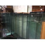 A group of 14 glass display cabinets.