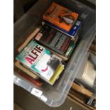 A plastic box of books