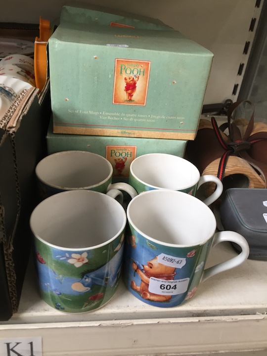 4 sets of 4 Winnie the Pooh mugs.