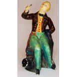 A George Wade & Son British Scintillite pottery figure depicting a man seated and enjoying a