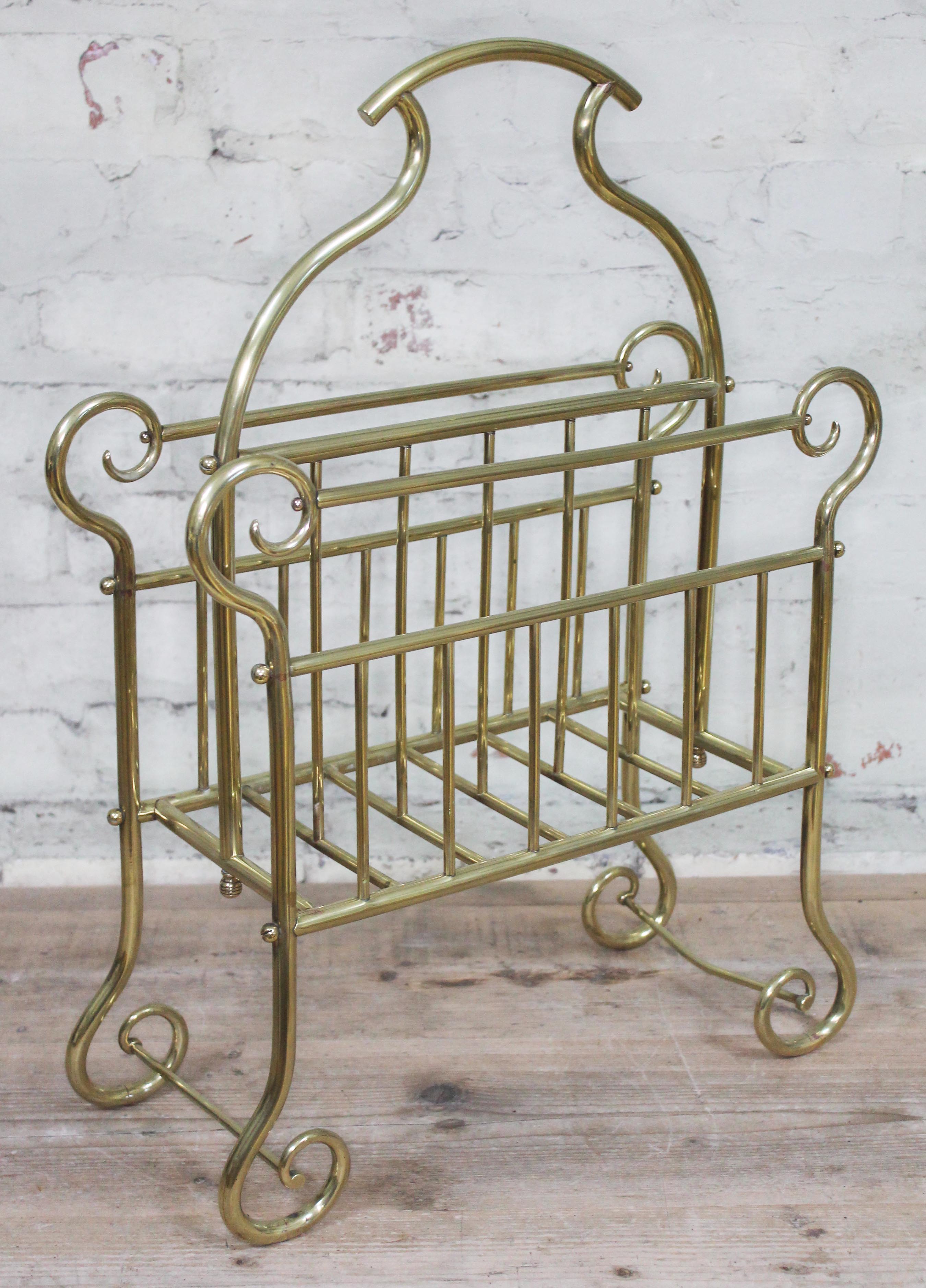 An Edwardian brass magazine rack, height 63cm.