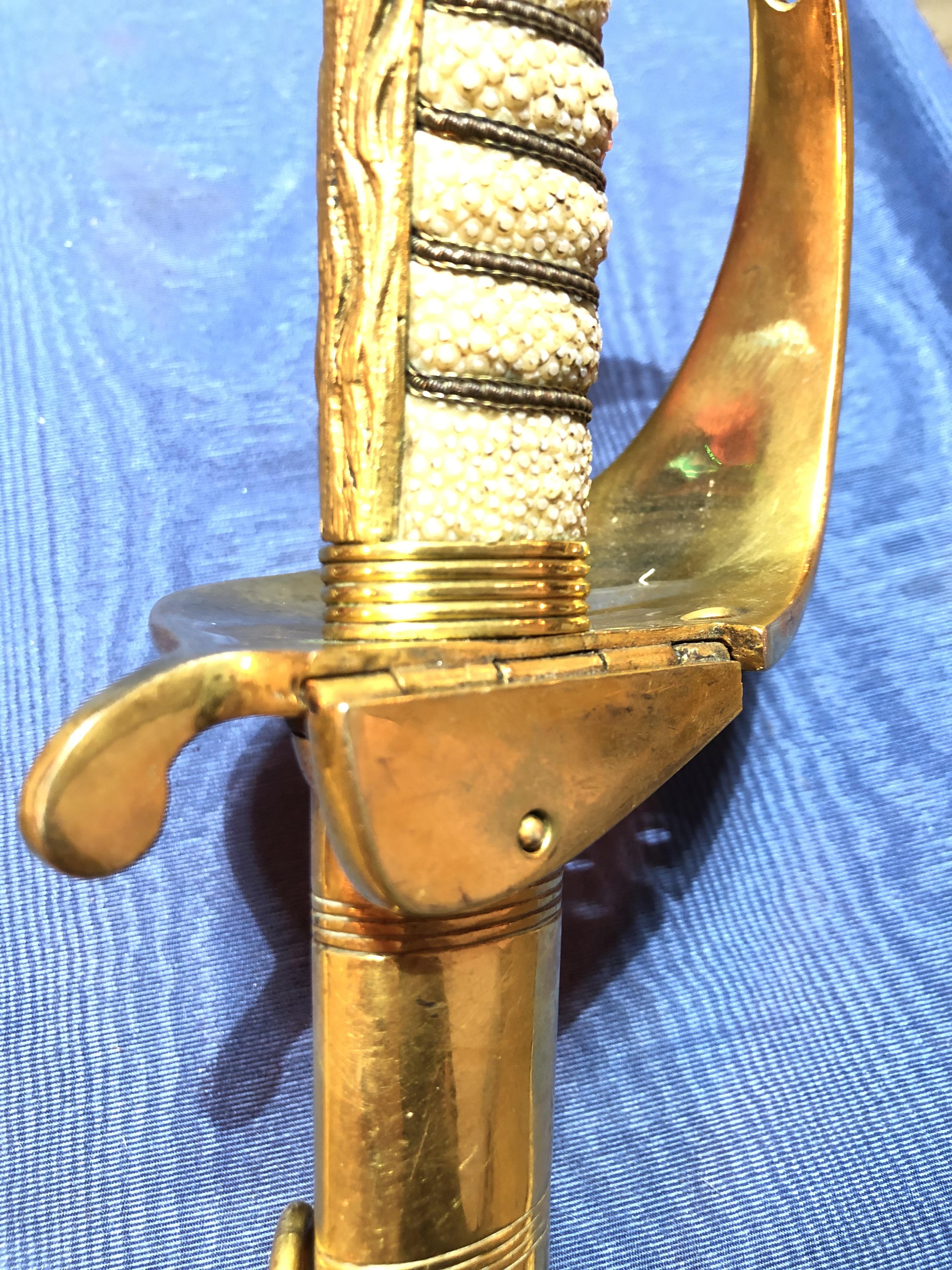 An Elizabeth II Navy officer's sword, the etched blade signed Gieves, with folding gilt brass hilt - Image 3 of 15