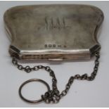 A hallmarked silver purse.