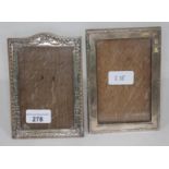 A hallmarked silver photo frame and another white metal, unmarked, 16cm x 11cm each.
