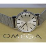 A ladies 1970s Omega Geneve 511.0457 stainless steel wristwatch with silver tone signed dial,
