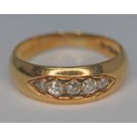 A hallmarked 18ct gold five stone diamond ring, gross wt. 4.5g, size N.